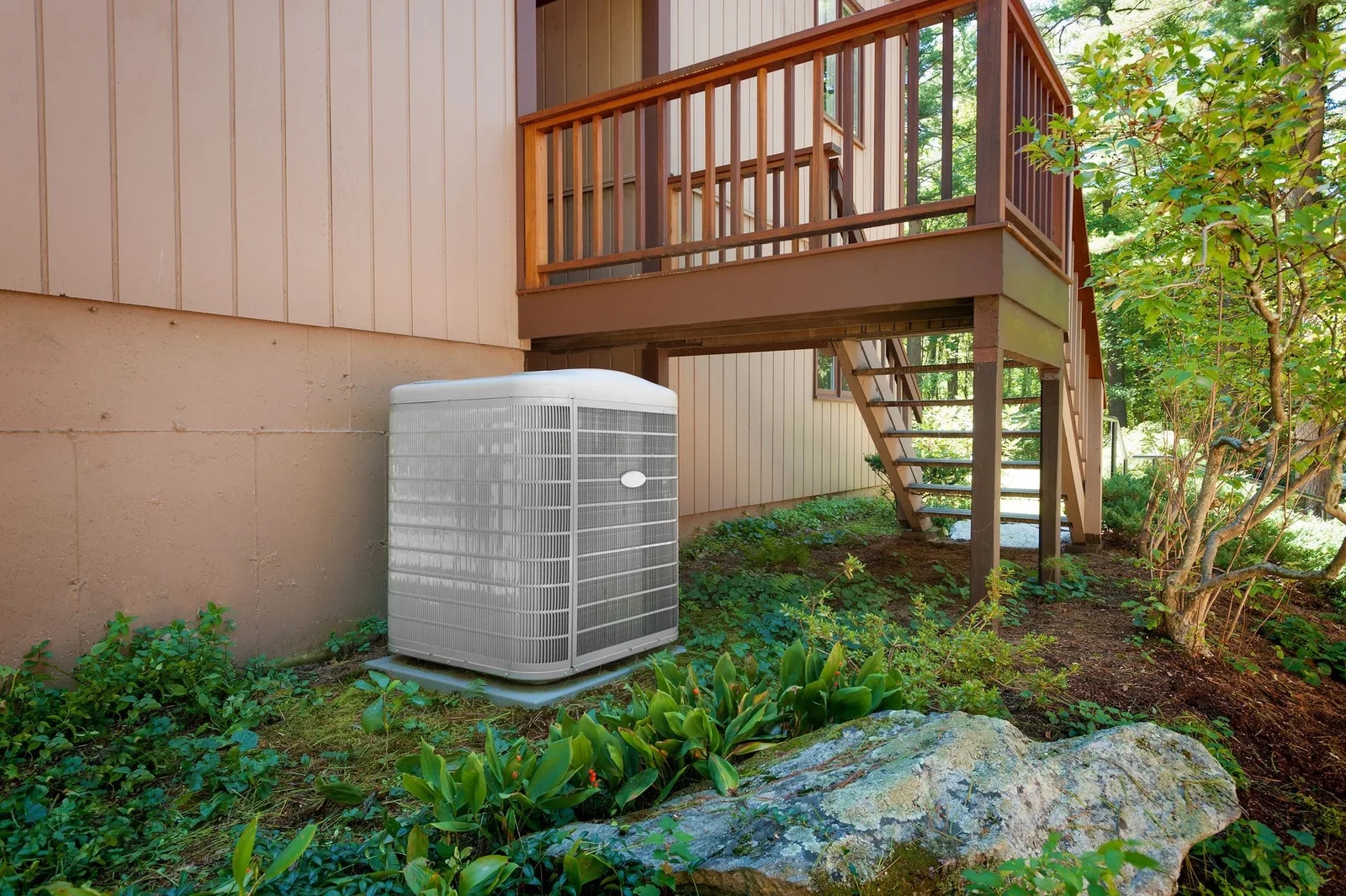 An air conditioning unit installed beside a home